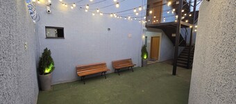Fully equipped apartment with air conditioning, linens, laundry facilities, and a grocery store.