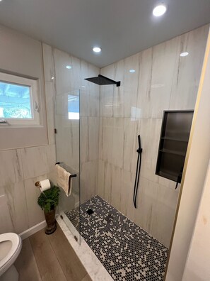 Shower, towels, soap, toilet paper