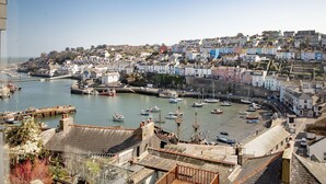 A coastal town with a harbor, boats, and colorful buildings. - Landscove Chalet 19 a charming and cosy South Devon holiday cottage (Brixham)