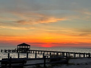 A pier with a gazebo and benches, overlooking a body of water. - Surfivin': Central location• Beach Club Access • Dining • Golf (Nags Head)