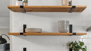 A kitchen with three wooden shelves, white tiled backsplash, and a wooden countertop. - Stylish + Trendy Home W/ Office Near It All! (Indianapolis)