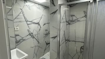 Studio, City View | Bathroom | Shower, slippers, towels, soap