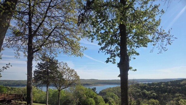 A park with a wooden deck, trees, and a lake view. - Romantic Seclusion Lake Norfork Cottage 10 w/Jacuzzi at Teal Point Resort w/private lake access (Mountain Home)