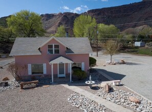 Exterior - Moab’s Iconic Pink Farmhouse | 3BR Home at the Foot of a Giant Mesa (Moab)