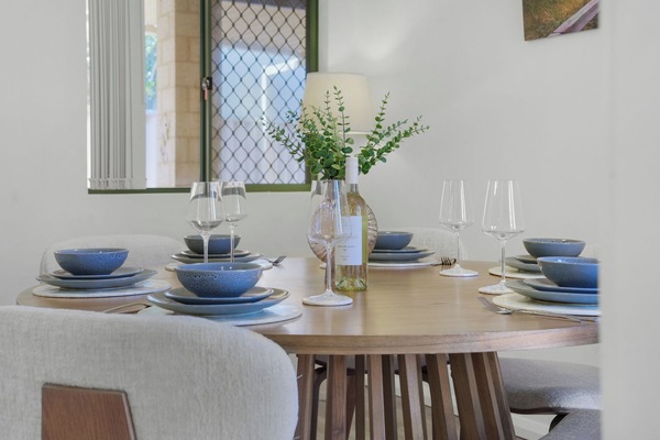 Stylish round dining table perfect for shared meals and celebrations.