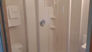 Shower, towels, soap, toilet paper