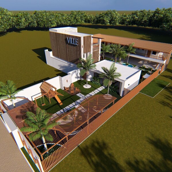 A modern hotel with a prominent 'VILLE' sign, a pool, and a well-maintained garden area.