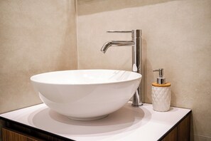 Bidet, towels, toilet paper