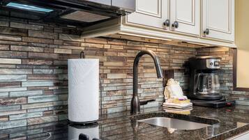 Fridge, microwave, stovetop, coffee/tea maker