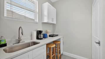 Coffee/tea maker, fridge, stovetop, toaster