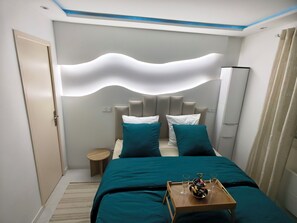 1 habitación, tabla de planchar con plancha, wifi gratis y ropa de cama 