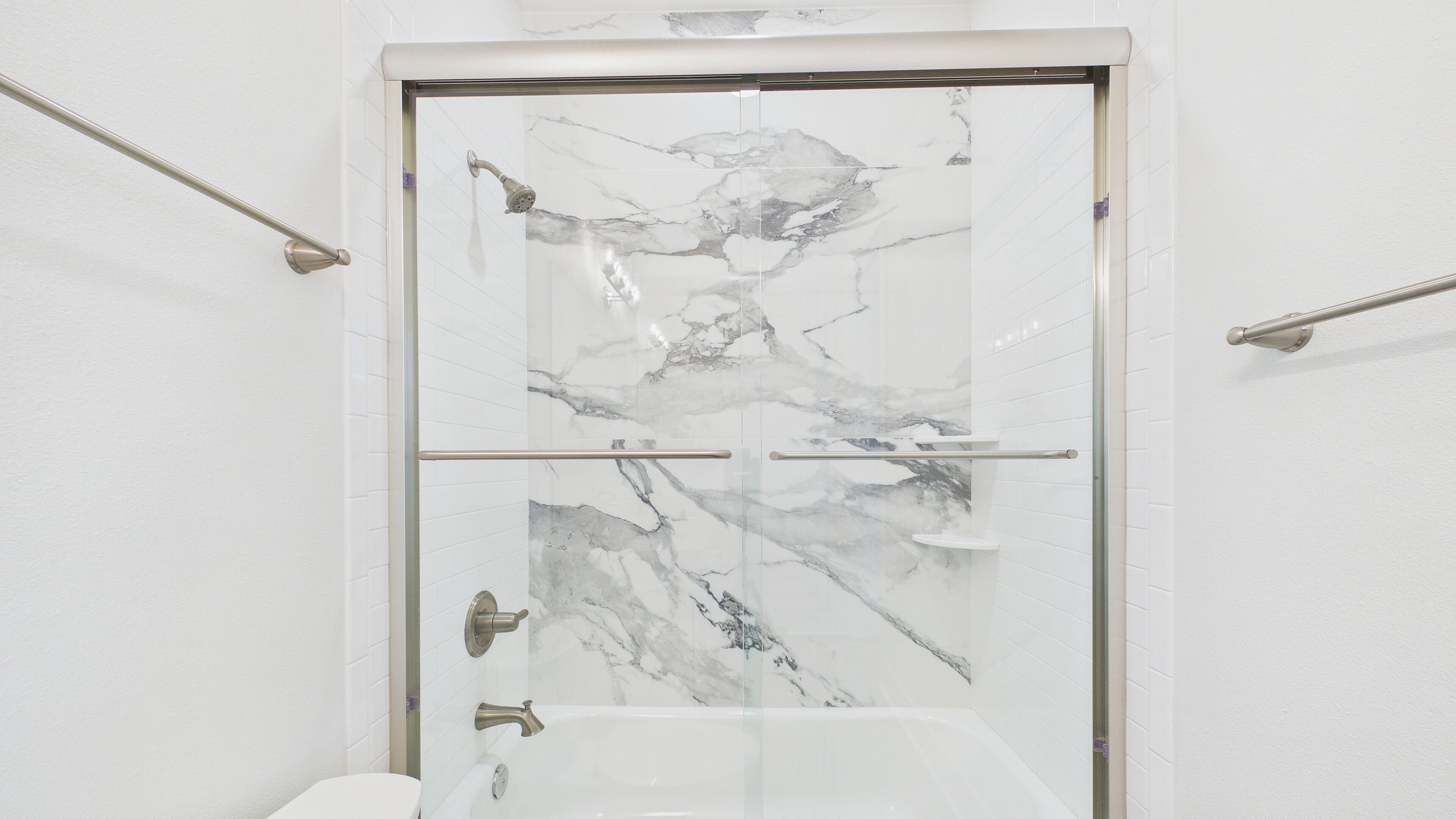 1st Floor: Full bathroom with shower and tub combo and dual vanity sinks