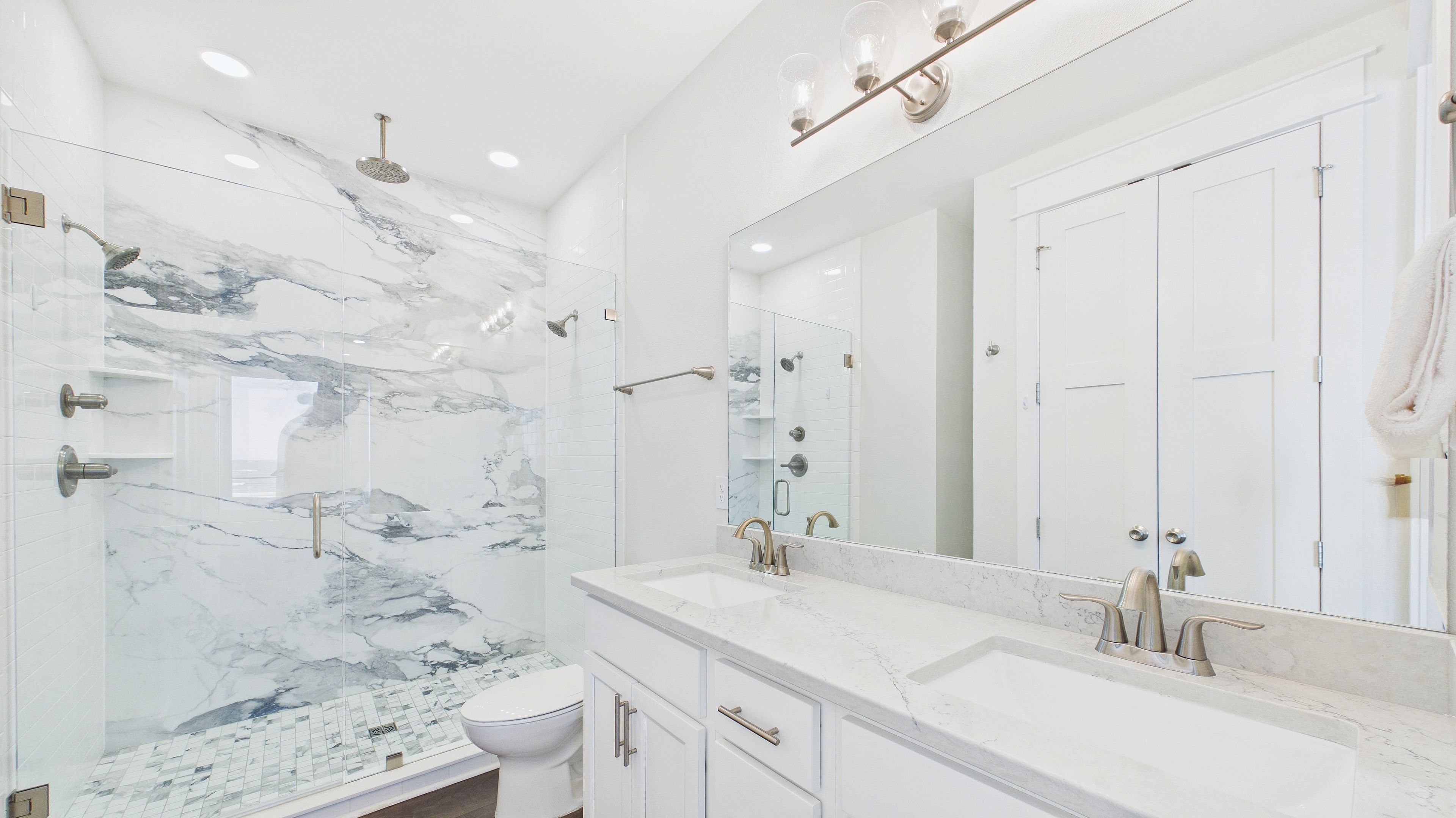 1st Floor: Full bathroom with beautiful walk in shower and dual vanity sinks