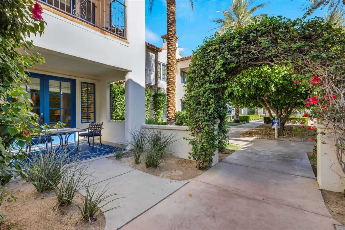 A residential property with a patio, a pool, and a garden.