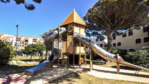 A playground with slides and a climbing structure. - Lovely home in Le Barcarès with lake view (Le Barcarès)