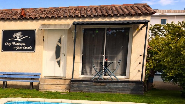 A building with a tiled roof, a pool, and a sign that reads 'Chez Frédérique et Jean-Claude.' - Amazing home in Taillades with outdoor swimming pool (Taillades)