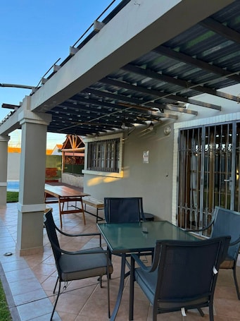 Outdoor dining. El encuentro residence Capital grill barbecue grill garage swimming pool and barbecue area