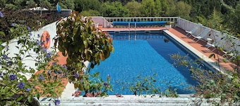 Secluded traditional country house in extensive grounds, with private pool.