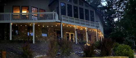 A stone building with a fire pit and outdoor seating.