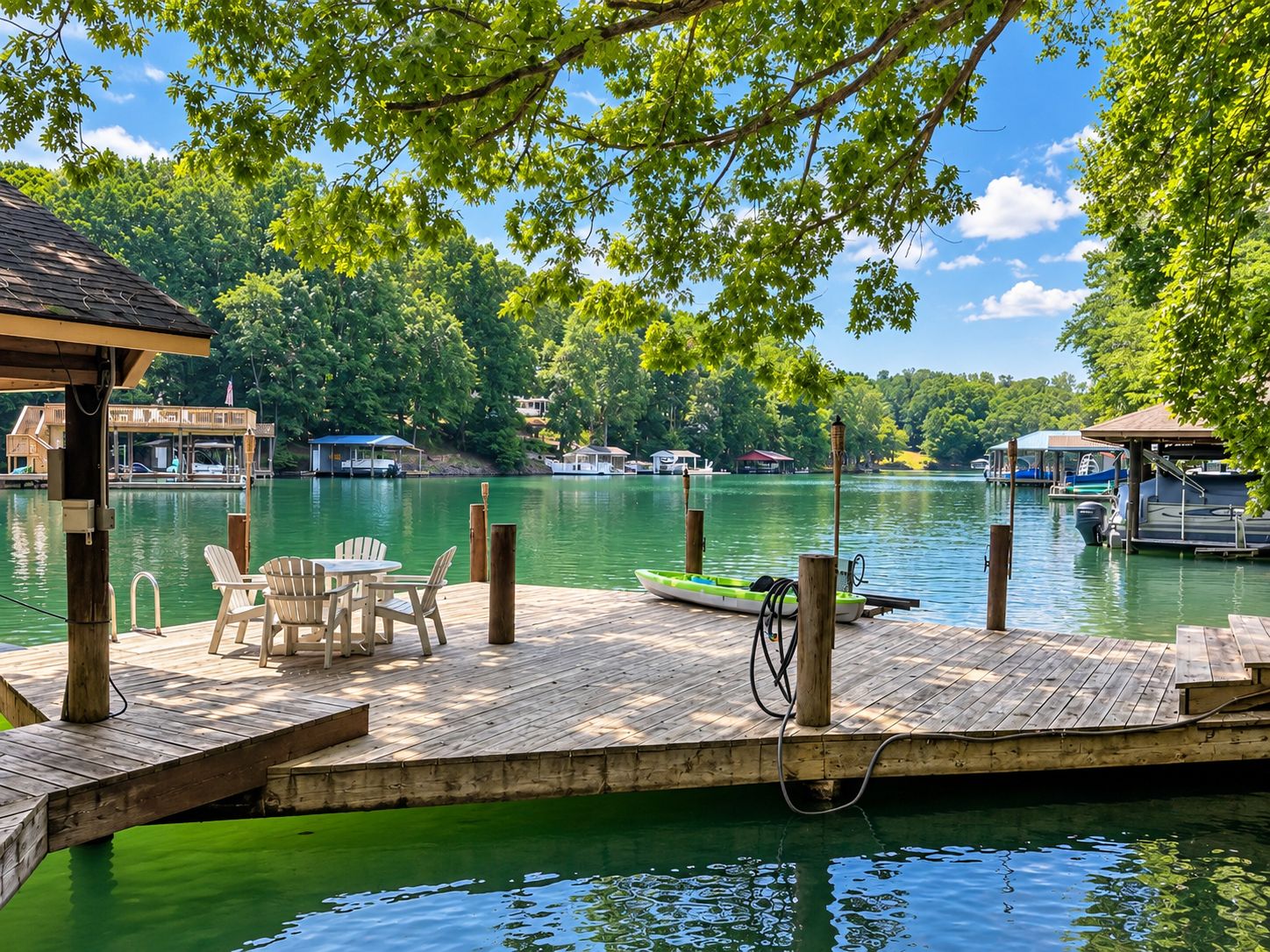 A wooden dock with chairs and a small boat, surrounded by calm water and greenery.