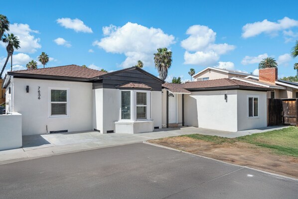 A residential house with a front driveway, a garage, and a well-maintained lawn. - Ranch-Style w Gated Yard, 4 Parking, 4 Bedroom 3 Bathroom (La Mesa)