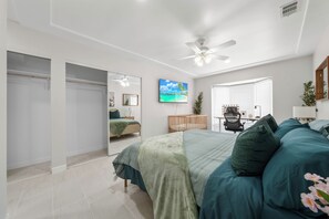 A bedroom with a bed, a desk, a chair, a ceiling fan, and a window. - Ranch-Style w Gated Yard, 4 Parking, 4 Bedroom 3 Bathroom (La Mesa)