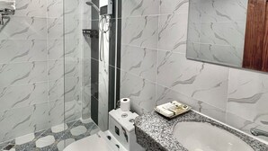 A modern bathroom with a toilet, bidet, and sink. - A Z Hotel Phnom Penh (Phnom Penh)
