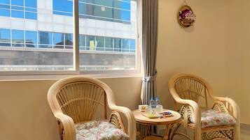 Deluxe Studio Suite, 1 King Bed, City View | Living area | 32-inch Smart TV with digital channels