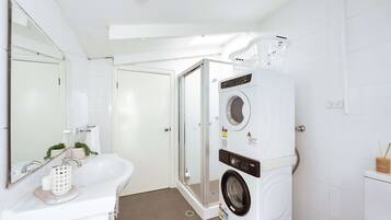 Shower, hair dryer, towels, shampoo