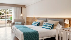 A hotel room with a bed, a view of the pool, and a chair by the window. - 1 Bedroom Junior Suite with kitchen, Pool and Garden Views, Full Bathroom, 40sq Metres, Balcony, Lar (Corralejo)