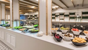 A buffet setup with various food items and a modern interior design. - 1 Bedroom Junior Suite with kitchen, Pool and Garden Views, Full Bathroom, 40sq Metres, Balcony, Lar (Corralejo)
