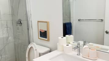 Shower, hair dryer, towels, soap