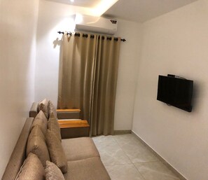 Quarto casal luxo | Área de estar