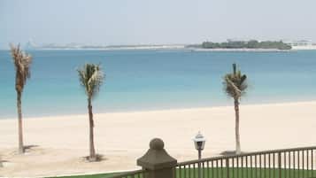 On the beach, sun-loungers, beach towels