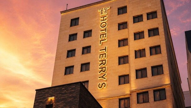 A hotel building with a prominent sign reading 'HOTEL TERRY'S' and multiple windows. - Suwon Station Hotel Terry's (Suwon)