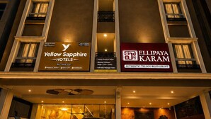 A hotel with a sign for 'Yellow Sapphire Hotels' and 'Ellipaya Karam' restaurant. - Yellow Sapphire Hotel DLF Cyber City (Hyderabad)
