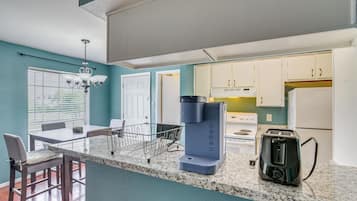 Fridge, stovetop, dishwasher, coffee/tea maker