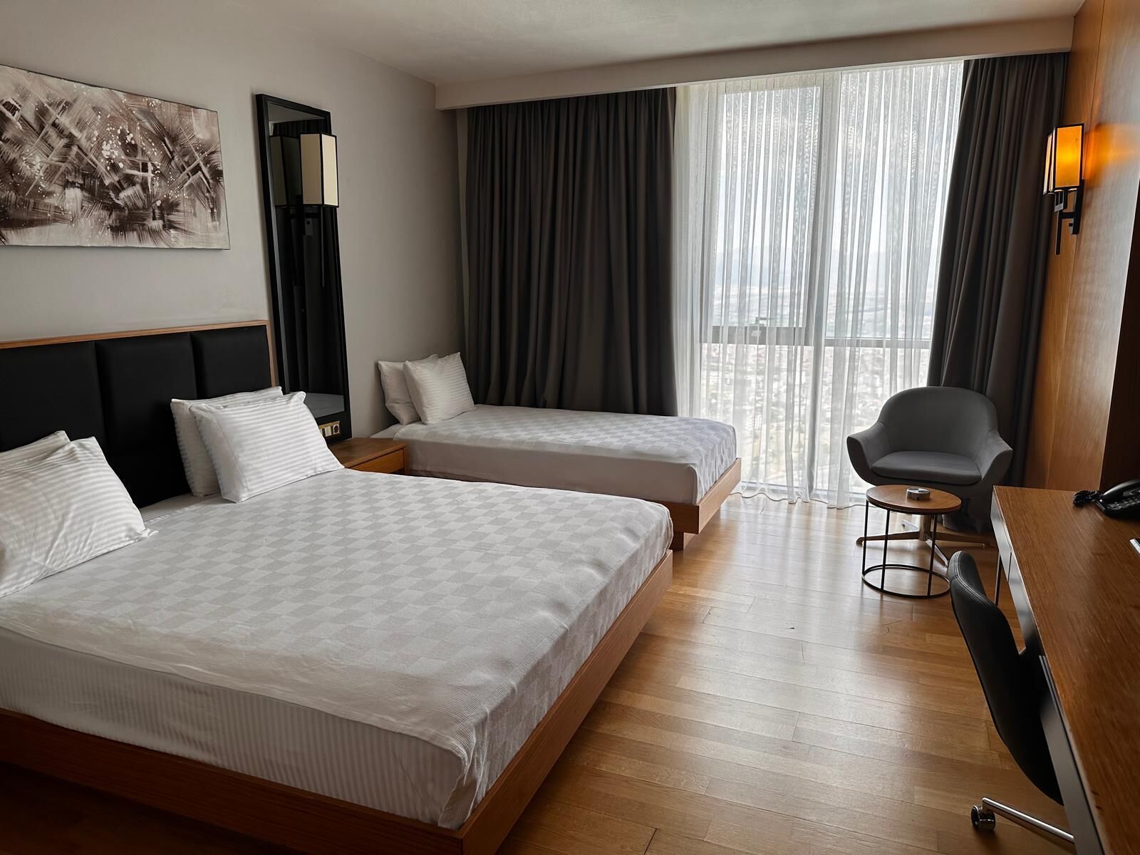 Family Triple Room, City View | Minibar, in-room safe, desk, soundproofing