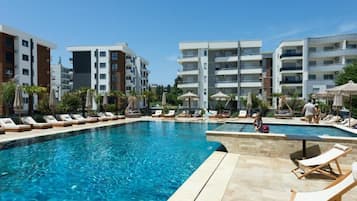 Seasonal outdoor pool, pool umbrellas, pool loungers