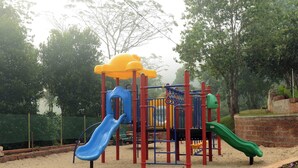 A playground with slides and climbing structures. - Upasana Retreat (Mudigere)
