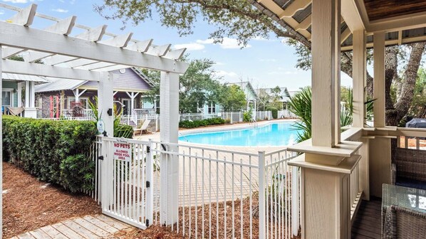 A pool area with a white fence, a no smoking sign, and a no pets sign. - 3BR Camp Creek Home in Seacrest With Pool & Beach Access (Panama City Beach)