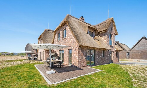 Premium vacation home Große Halbe Düne in the dune park with terrace and sauna