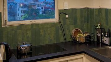 Fridge, microwave, electric kettle, cookware/dishes/utensils