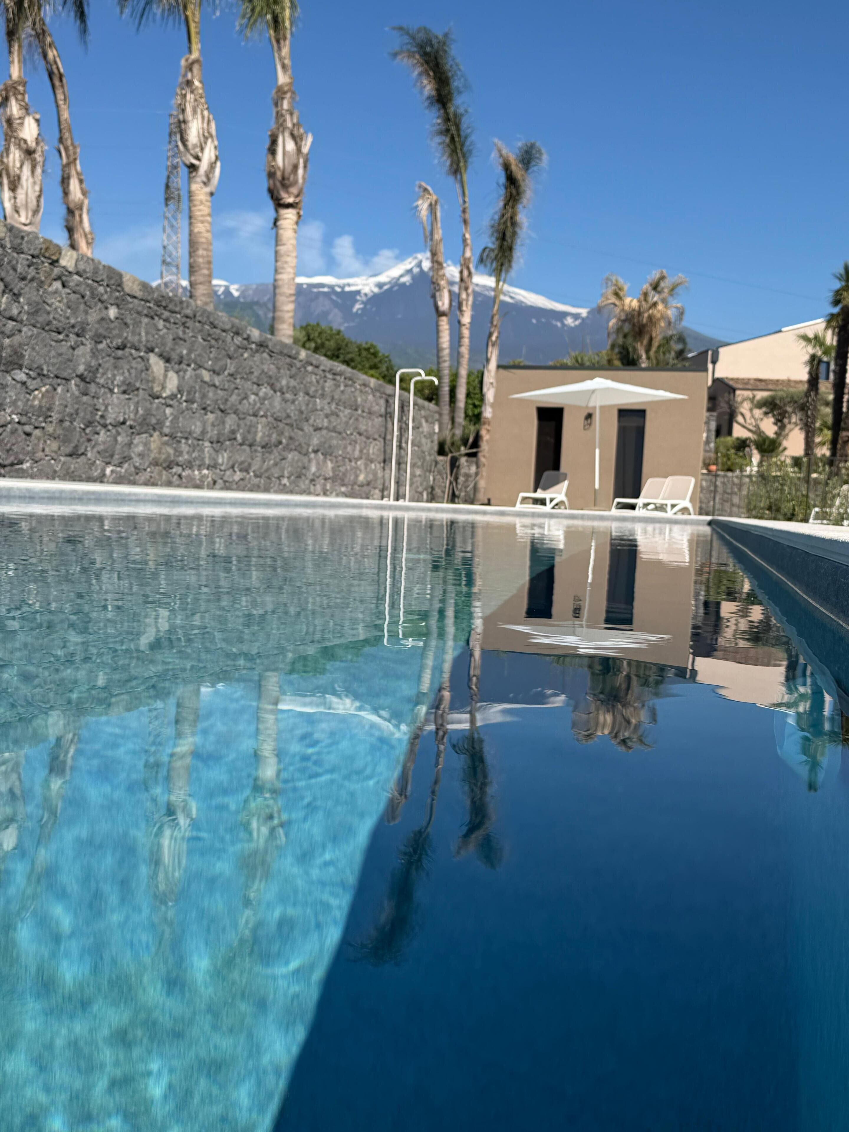 Outdoor pool, open 8:00 AM to 7:00 PM, pool umbrellas, pool loungers