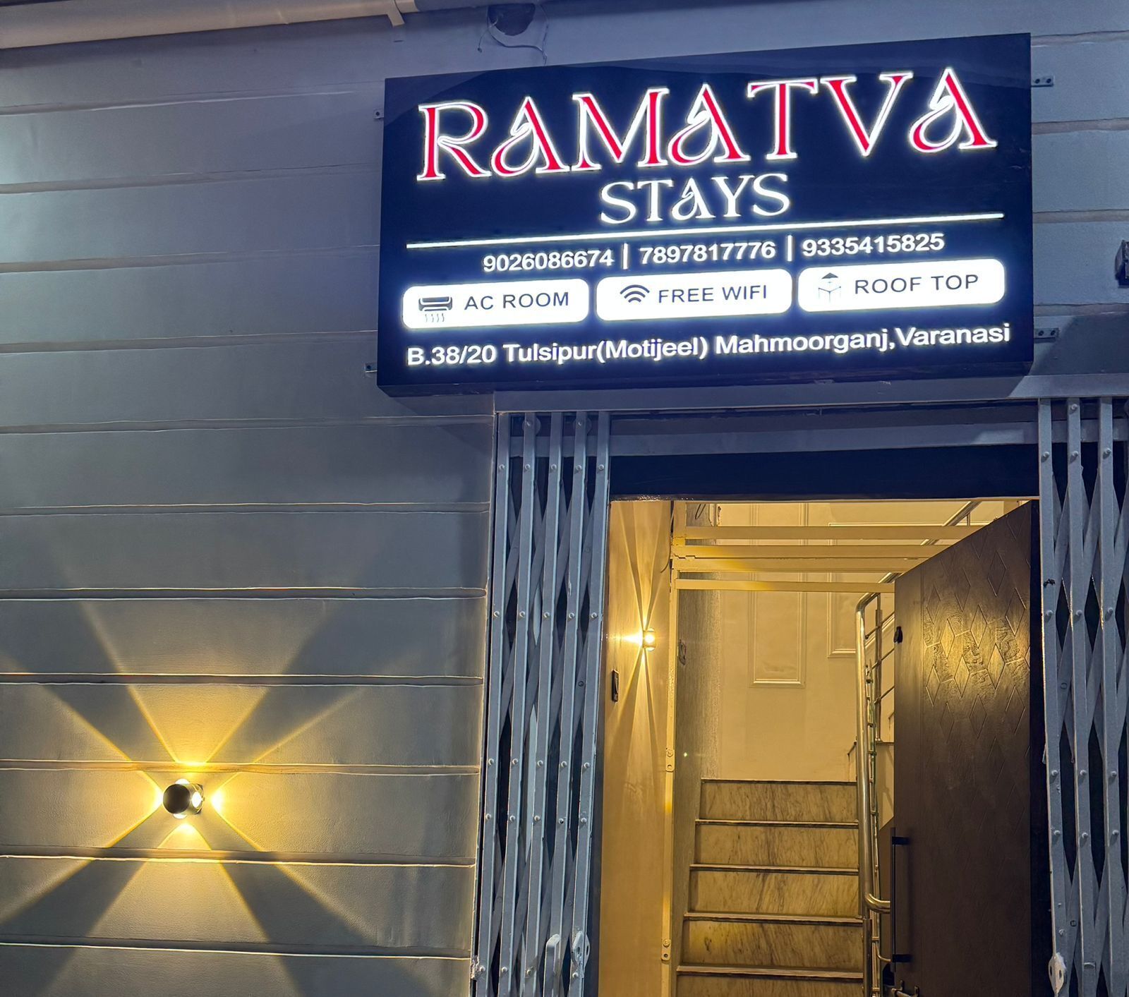 A sign for Ramata Stays with amenities like AC room, free WiFi, and a roof top.