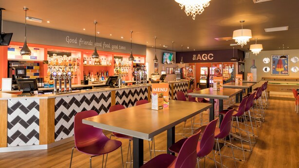 A bar area with a counter, multiple taps, and a menu stand. - Spacious 3-Room Van at Birchington Vale (Birchington-on-Sea)
