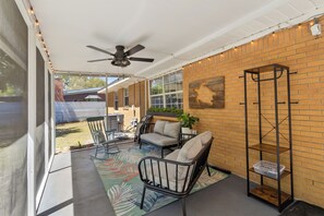 Terrace/patio - Perfect for families and groups! Enjoy a spacious home with a screened patio, fire pit, and kid-friendly yard. Prime location near the Science Center and main roads. Flexible beds make it ideal for extended stays. Comfort and connection await! (Fort Walton Beach)