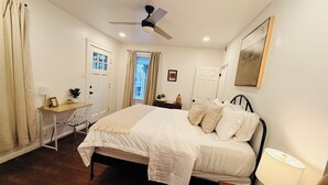 A bedroom with a bed, desk, chair, and a ceiling fan. - Renovated 2BR - Workspace - Near UC Med & Cincy (Saint Bernard)