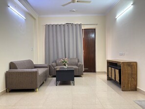 Apartment, Balcony, City View | Living area | 42-inch Smart TV with digital channels - Fortune Home Service Apartment Sector-72 (Noida)