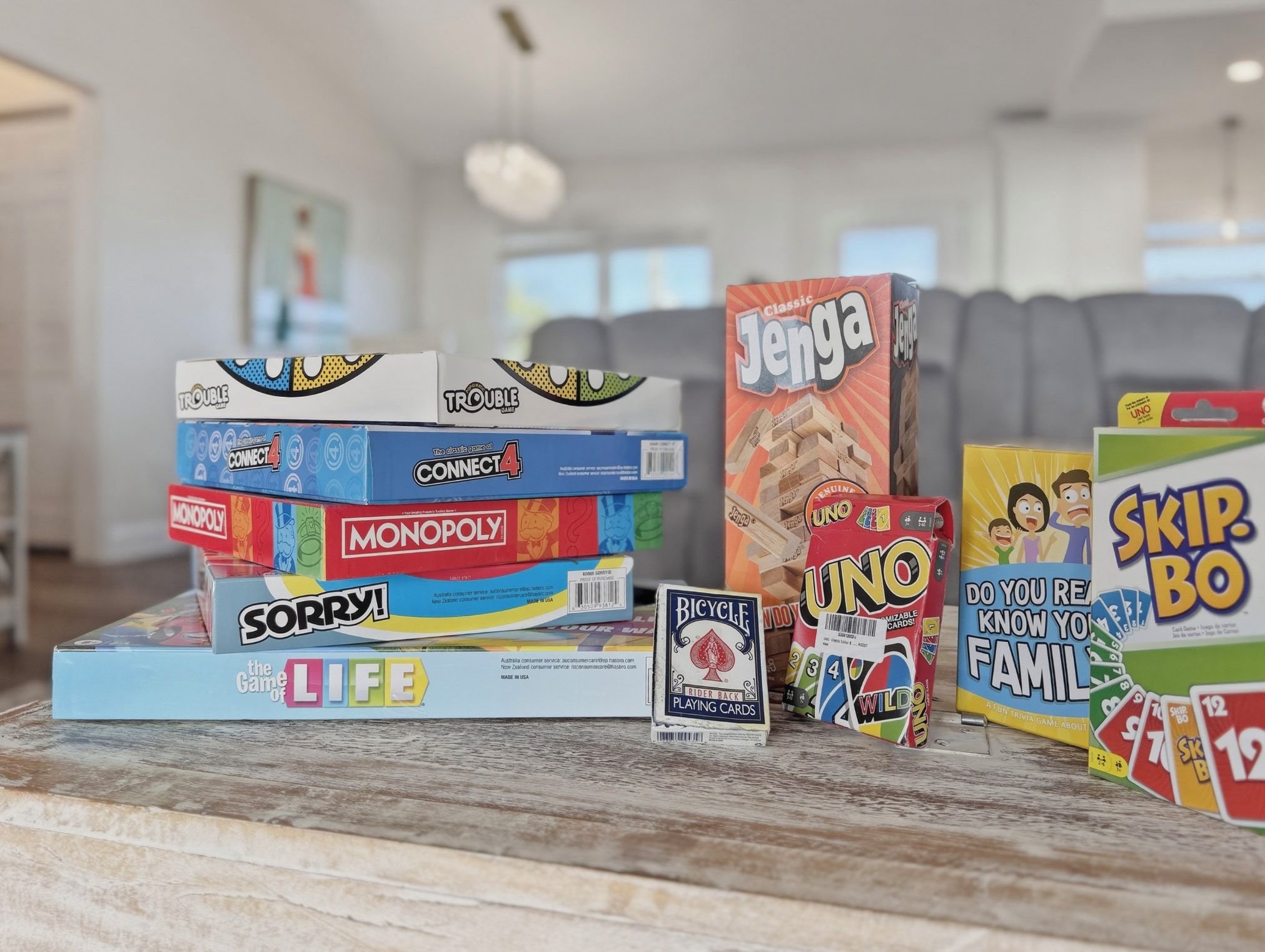 A variety of board games on a table.